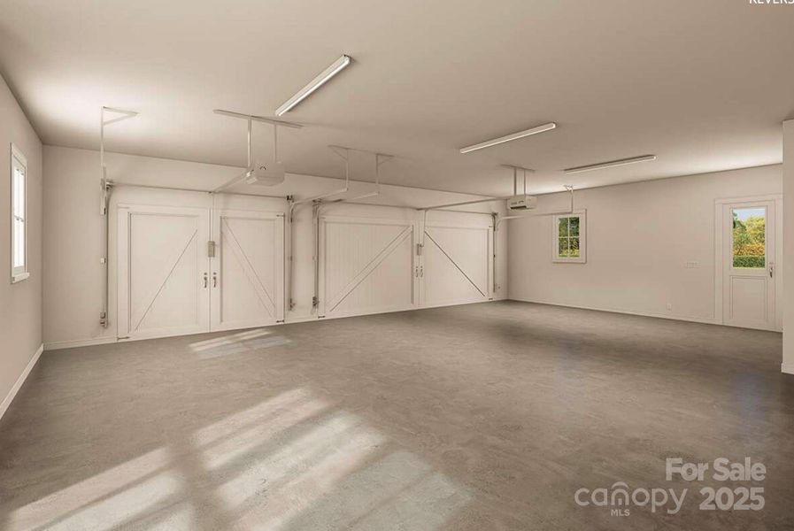 This oversized three-car garage features carriage-style doors, durable concrete flooring, multiple windows for natural light, modern openers, and a convenient side entry. This oversized three-car garage features carriage-style doors, durable concrete flooring, multiple windows for natural light, modern openers, and a convenient side entry.