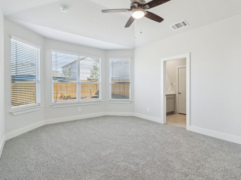 Primary suite in the San Saba floorplan at a Meritage Homes community.
