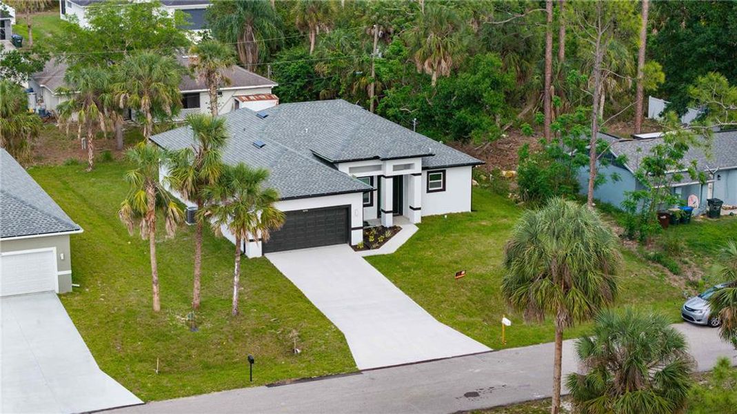 Front exterior of a new home in , North Port, FL, highlighting curb appeal (Image 23).