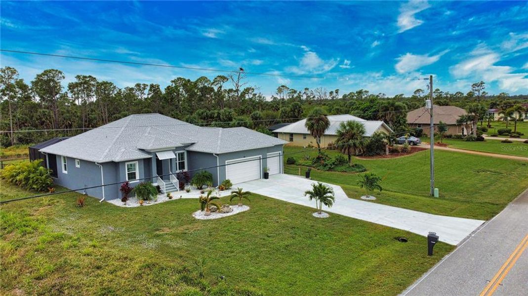 Front exterior of a new home in , Rotonda West, FL, highlighting curb appeal (Image 25).