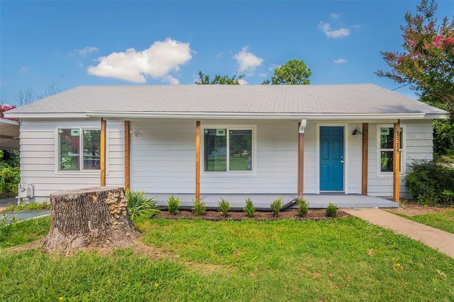 Ranch-style house featuring a front yard and a porch