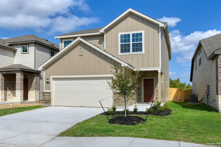 Front exterior of a new home in Meadows at Hennersby Hollow 40's, San Antonio, TX, highlighting curb appeal (Image 2). Front exterior of a new home in Meadows at Hennersby Hollow 40's, San Antonio, TX, highlighting curb appeal (Image 2).