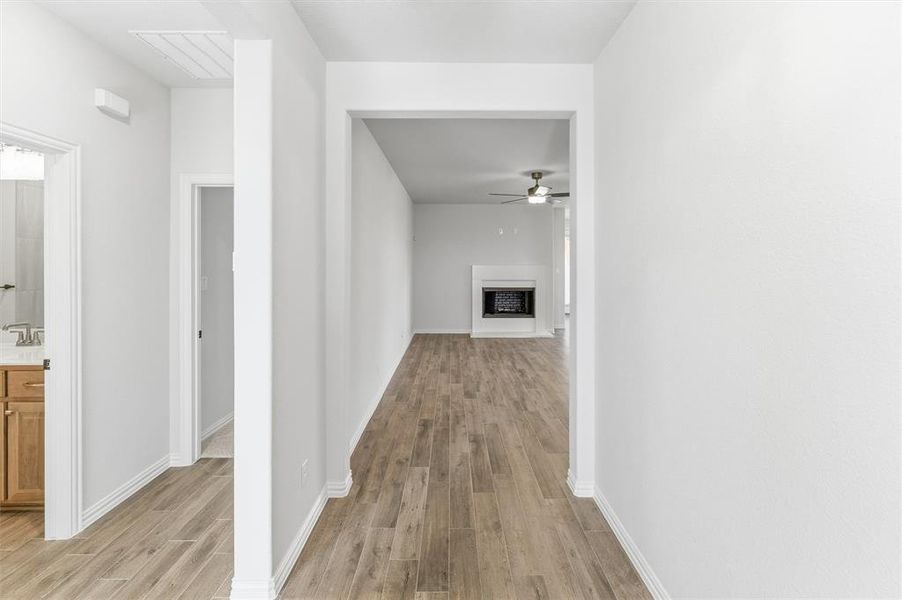 Hallway featuring light wood-style flooring