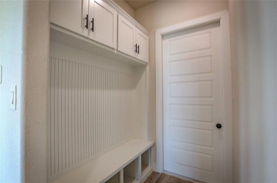 Mudroom with hardwood / wood-style floors