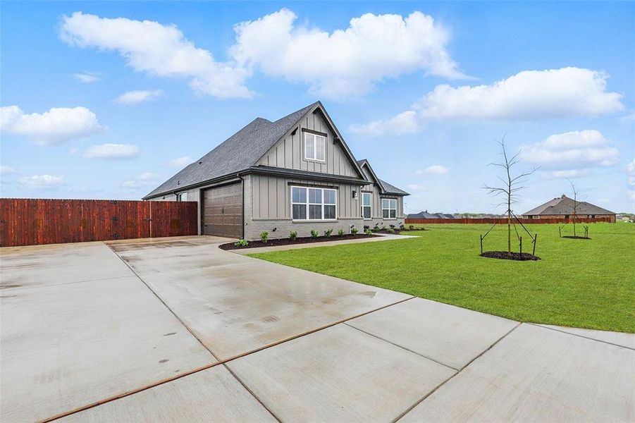 Front exterior of a new home in Coyote Crossing, Godley, TX, highlighting curb appeal (Image 11). Front exterior of a new home in Coyote Crossing, Godley, TX, highlighting curb appeal (Image 11).