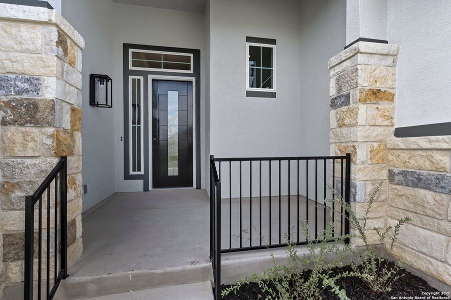 Exterior details and patio area of a home in The Reserve at Potranco Oaks, Castroville (Image 16).