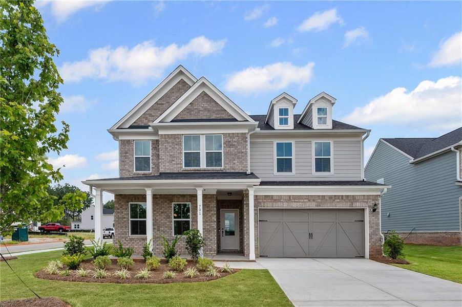 Front exterior of a new home in Hawthorne Ridge, McDonough, GA, highlighting curb appeal (Image 18).
