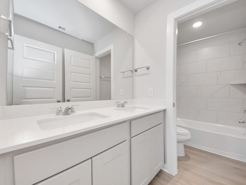 Furnished interior view inside a new home in Spring Branch Crossing, Conroe (Image 12).