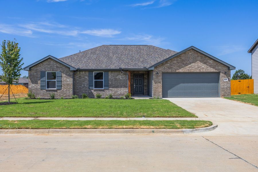 Front exterior of a new home in Courtland Place, Cleburne, TX, highlighting curb appeal (Image 1). Front exterior of a new home in Courtland Place, Cleburne, TX, highlighting curb appeal (Image 1).