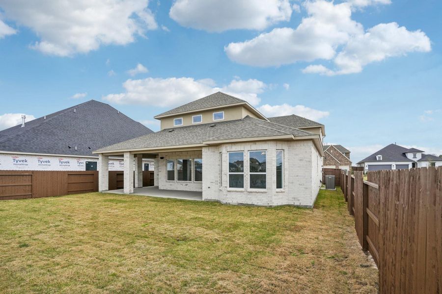 Exterior details and patio area of a home in Del Bello Lakes 60', Manvel (Image 25).