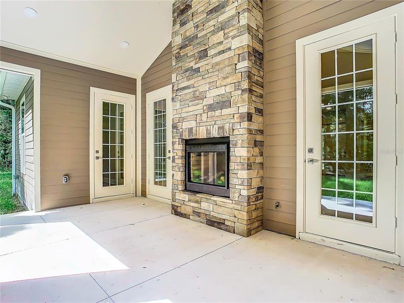 back porch with double sided fireplace