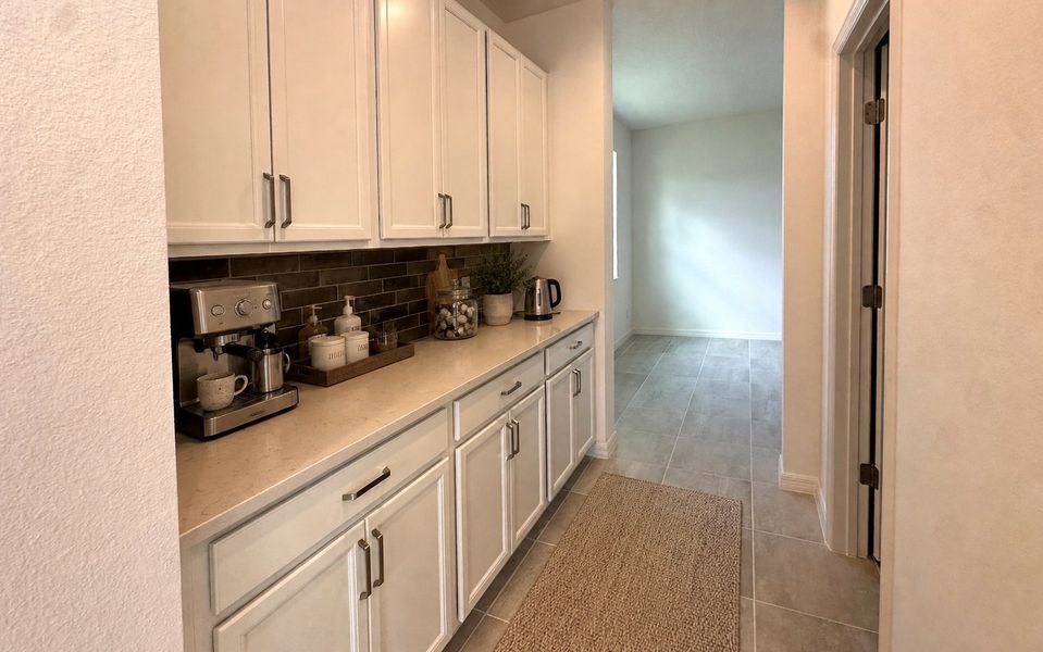 Furnished interior view inside a new home in Trinity Gardens, Deland (Image 7).