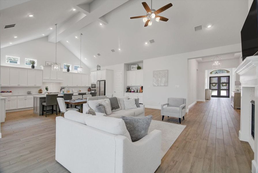 From the front door all the way into the family room, the home features high ceilings, recessed lighting, and tile flooring that carries seamlessly through the main living areas. This creates an open, bright, and cohesive feel from the moment you walk in.