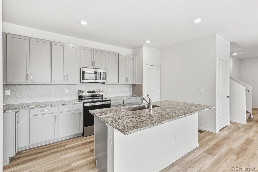 Furnished interior view inside a new home in Sky Ranch Villas, Watkins (Image 6).
