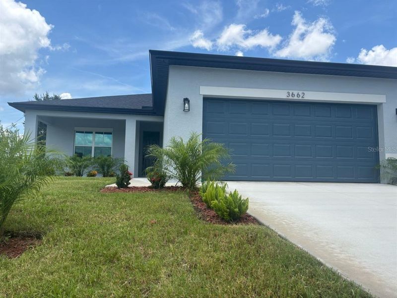Front exterior of a new home in , North Port, FL, highlighting curb appeal (Image 16). Front exterior of a new home in , North Port, FL, highlighting curb appeal (Image 16).