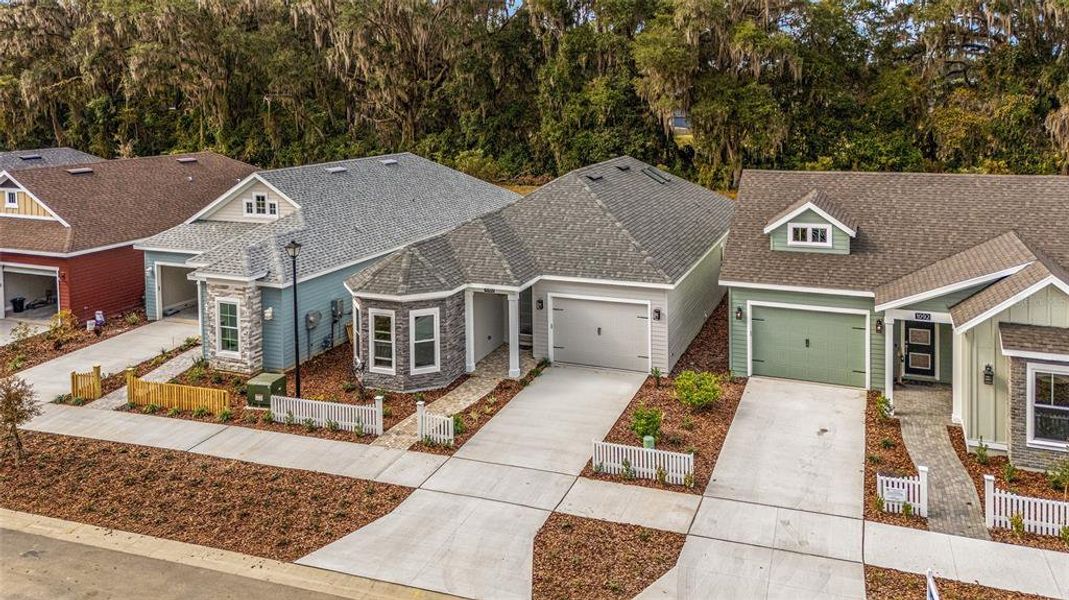 Front exterior of a new home in Fairway Pointe at West End, Newberry, FL, highlighting curb appeal (Image 21).