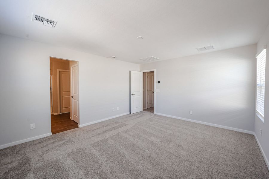 A room with white walls and a wood floor.