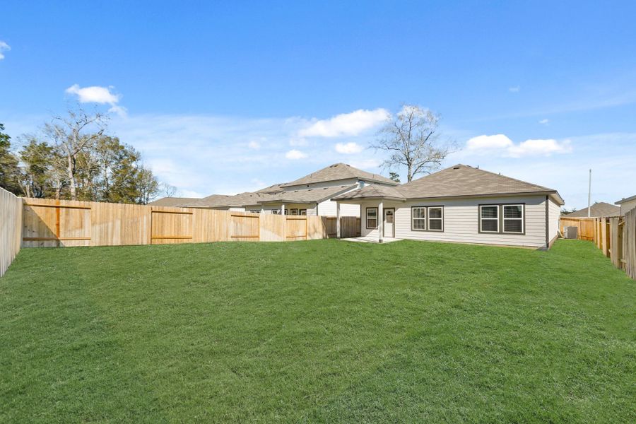 Exterior details and patio area of a home in Lakes at Crockett Martin, Conroe (Image 18).