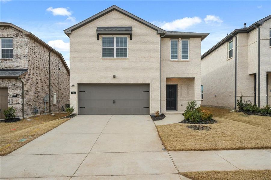 Front of property featuring a garage