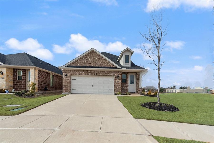 Front exterior of a new home in Walden Pond, Forney, TX, highlighting curb appeal (Image 18).