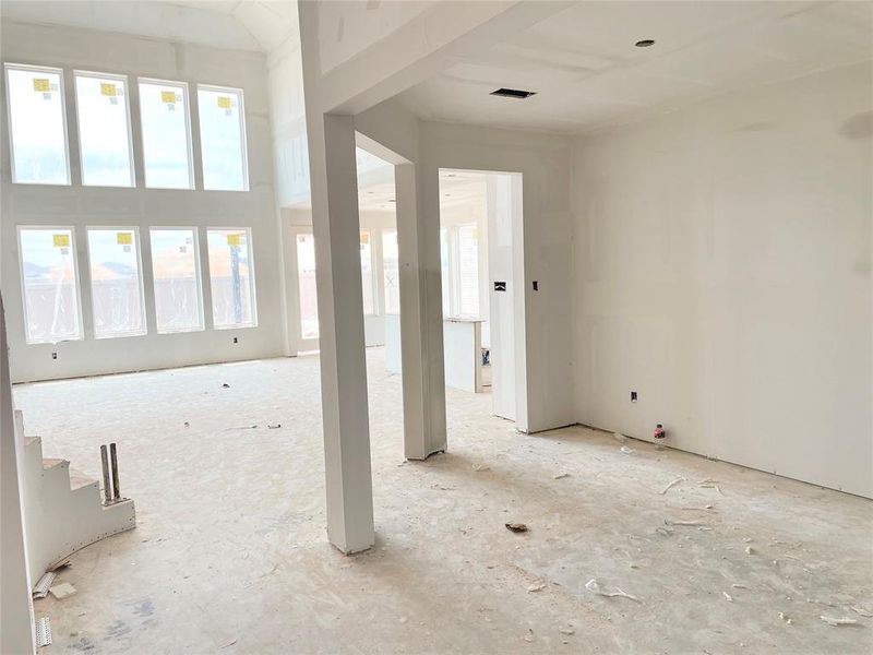 Formal Dining Overlooking the Wall of Windows