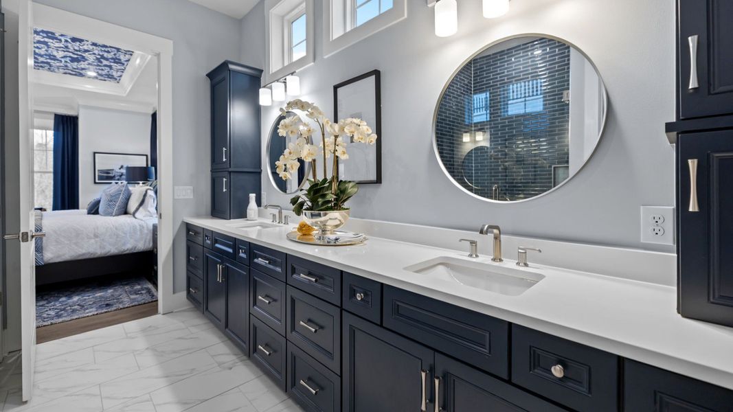 The Adventurer Plan with a modern bathroom featuring a glass-enclosed shower lined with rich navy blue tiles in Fort Mill, SC