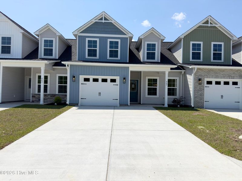 Front exterior of a new home in Autumn Trail, Bolivia, NC, highlighting curb appeal (Image 17). Front exterior of a new home in Autumn Trail, Bolivia, NC, highlighting curb appeal (Image 17).
