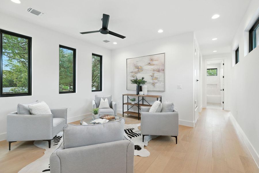 Sitting room featuring recessed lighting, light wood finished floors, and a ceiling fan Sitting room featuring recessed lighting, light wood finished floors, and a ceiling fan