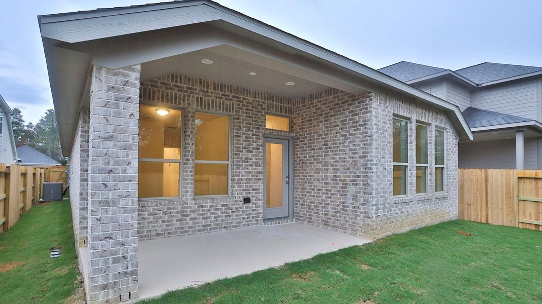Exterior details and patio area of a home in Woodhavyn 40', Magnolia (Image 3). Exterior details and patio area of a home in Woodhavyn 40', Magnolia (Image 3).