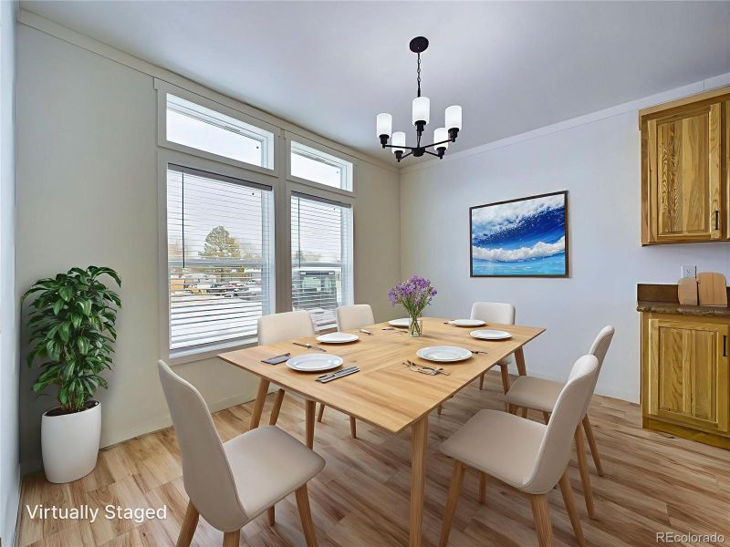 Dining with 2 large windows looking out front