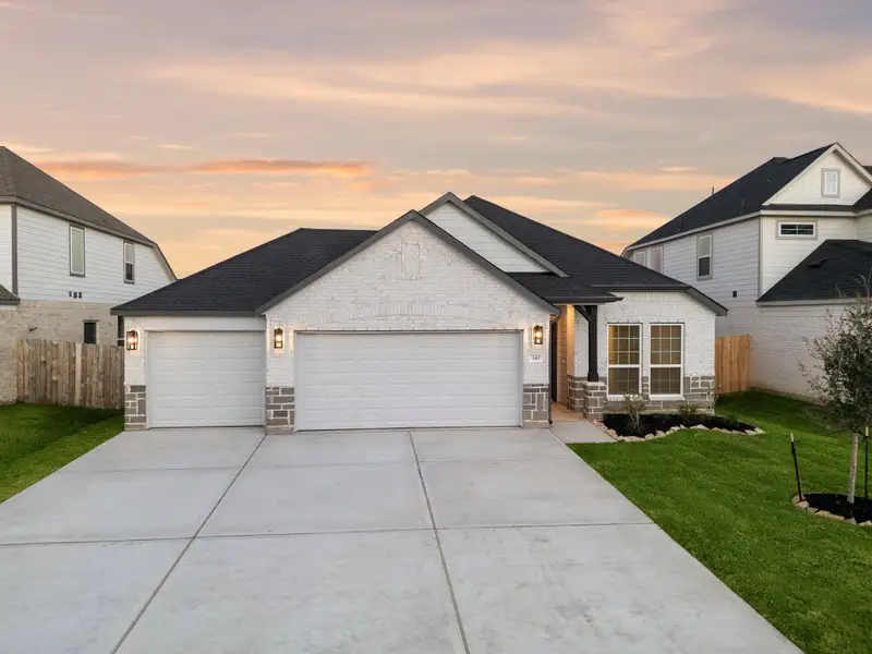 Front exterior of a new home in Beacon Hill, Waller, TX, highlighting curb appeal (Image 1). Front exterior of a new home in Beacon Hill, Waller, TX, highlighting curb appeal (Image 1).