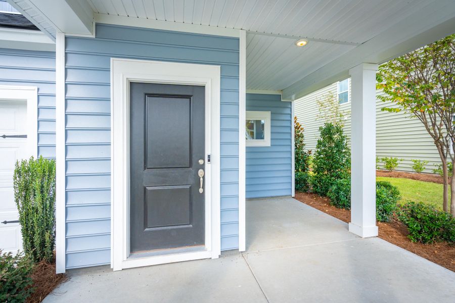 Front exterior of a new home in Heron's Walk at Summers Corner: Carolina Collection, Summerville, SC, highlighting curb appeal (Image 2). Front exterior of a new home in Heron's Walk at Summers Corner: Carolina Collection, Summerville, SC, highlighting curb appeal (Image 2).
