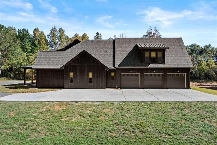 Front exterior of a new home in , Monroe, GA, highlighting curb appeal (Image 1).