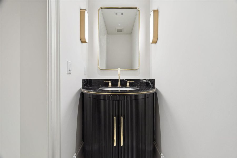 Downstairs powder bathroom. Downstairs powder bathroom.