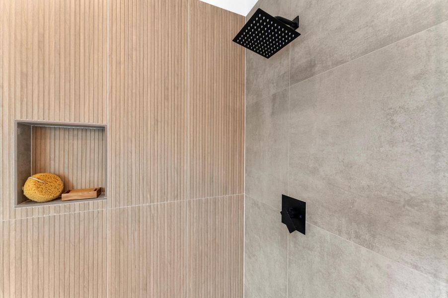 This luxurious primary bathroom blends modern elegance with spa-like comfort, featuring a spacious layout and contemporary selections throughout. A sleek double vanity with minimalist cabinetry and polished countertops offers ample storage and style, while the glass-enclosed shower includes a built-in bench for added relaxation and convenience. The centerpiece is a sculptural freestanding soaking tub, perfectly positioned to invite unwinding after a long day. This luxurious primary bathroom blends modern elegance with spa-like comfort, featuring a spacious layout and contemporary selections throughout. A sleek double vanity with minimalist cabinetry and polished countertops offers ample storage and style, while the glass-enclosed shower includes a built-in bench for added relaxation and convenience. The centerpiece is a sculptural freestanding soaking tub, perfectly positioned to invite unwinding after a long day.