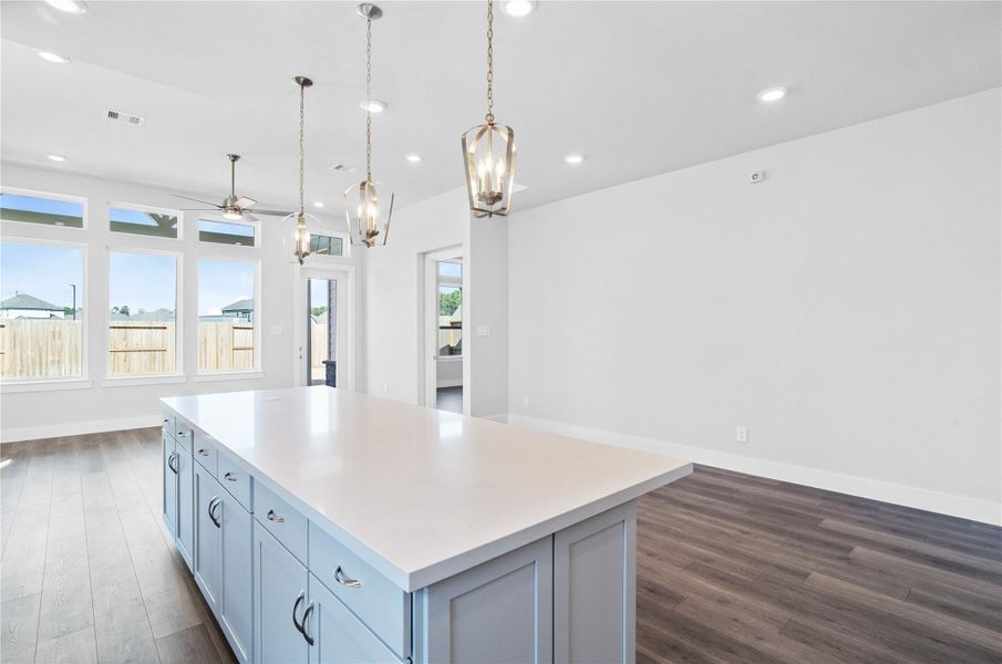 The intentional open design fosters a deep sense of connection between all three primary living zones. Sightlines remain clear from the sink to the sofa, promoting inclusive living and effortless entertaining.