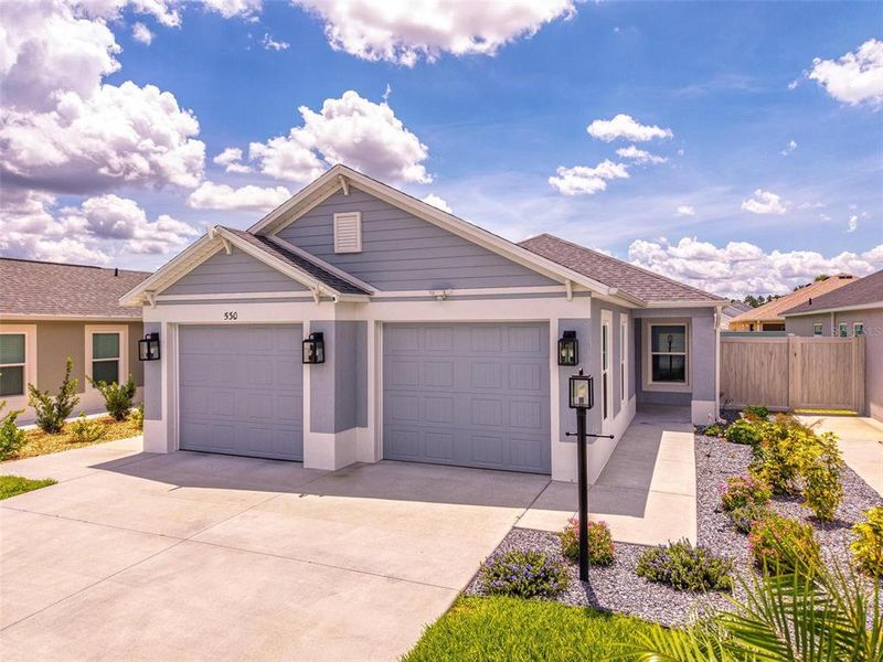 Front exterior of a new home in , The Villages, FL, highlighting curb appeal (Image 25).