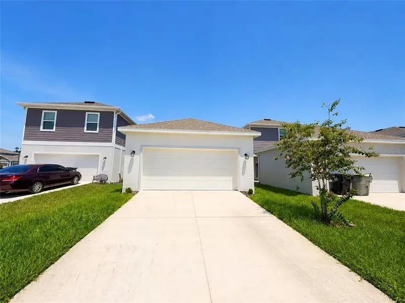 Front exterior of a new home in , Apopka, FL, highlighting curb appeal (Image 2). Front exterior of a new home in , Apopka, FL, highlighting curb appeal (Image 2).