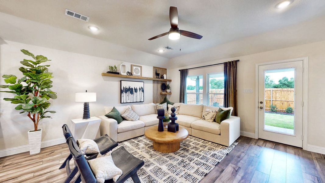 A living room with a large window. A living room with a large window.