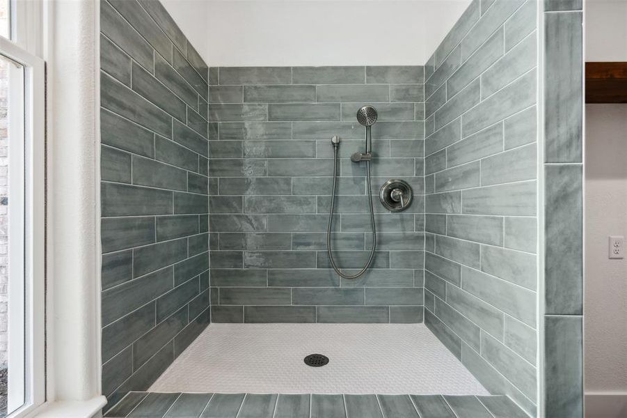 Bathroom with a tile shower