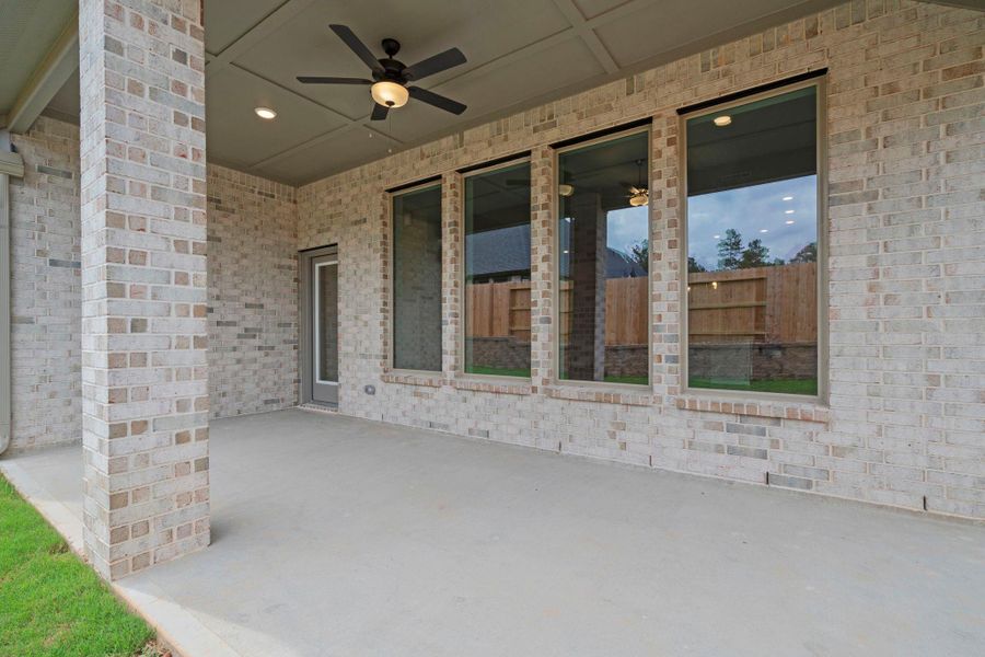 Exterior details and patio area of a home in Wildtree, Magnolia (Image 3).