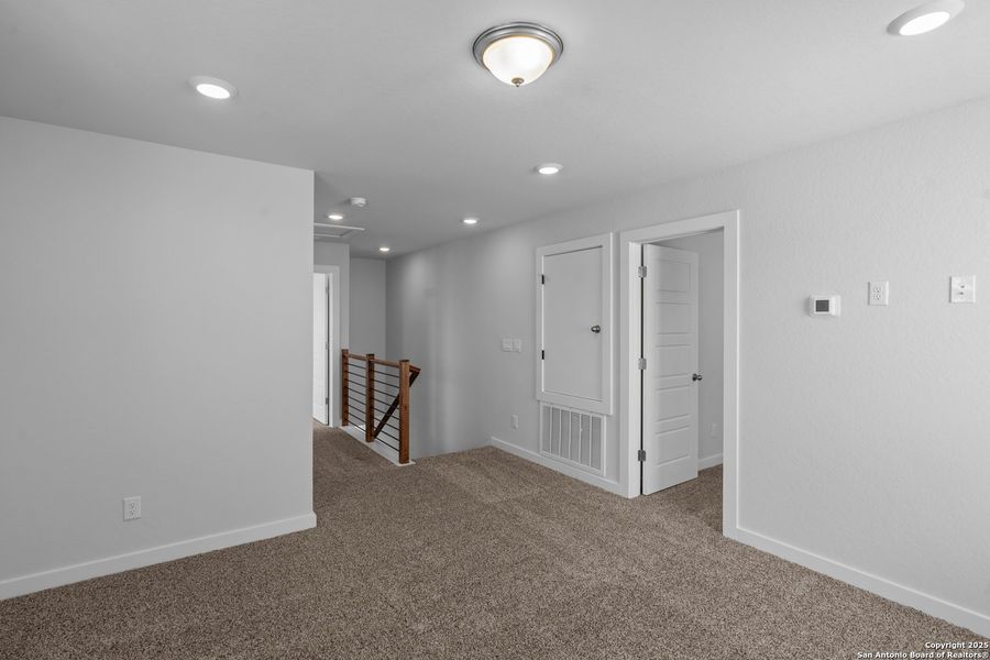 Spacious, unfurnished interior of a new home in The Meadows at Hunters Ranch, San Antonio (Image 11).