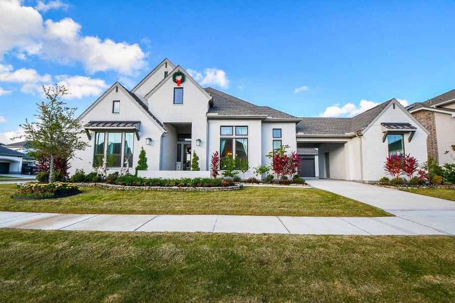 Front exterior of a new home in , Cypress, TX, highlighting curb appeal (Image 1). Front exterior of a new home in , Cypress, TX, highlighting curb appeal (Image 1).