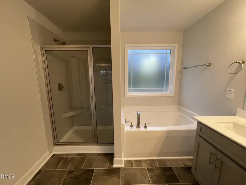 Soaking tub and tiled shower