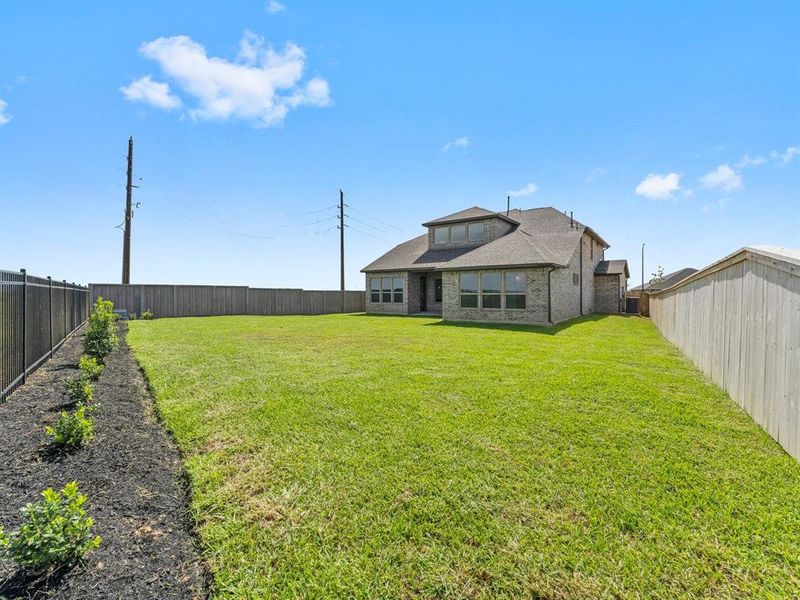 Spacious Back Yard with Full Sprinklers