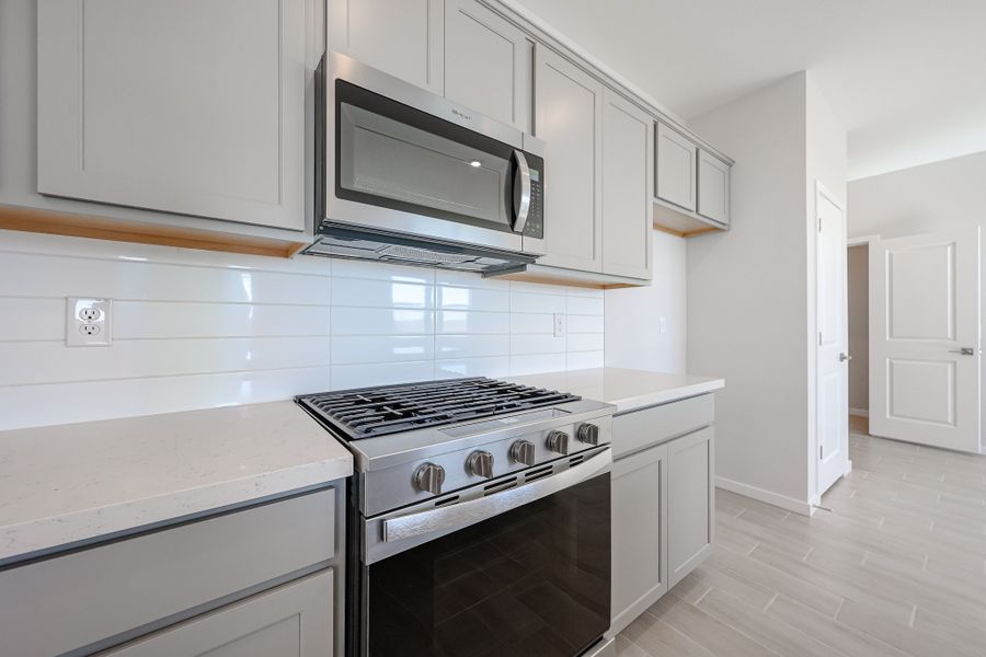 A kitchen with white cabinets. A kitchen with white cabinets.