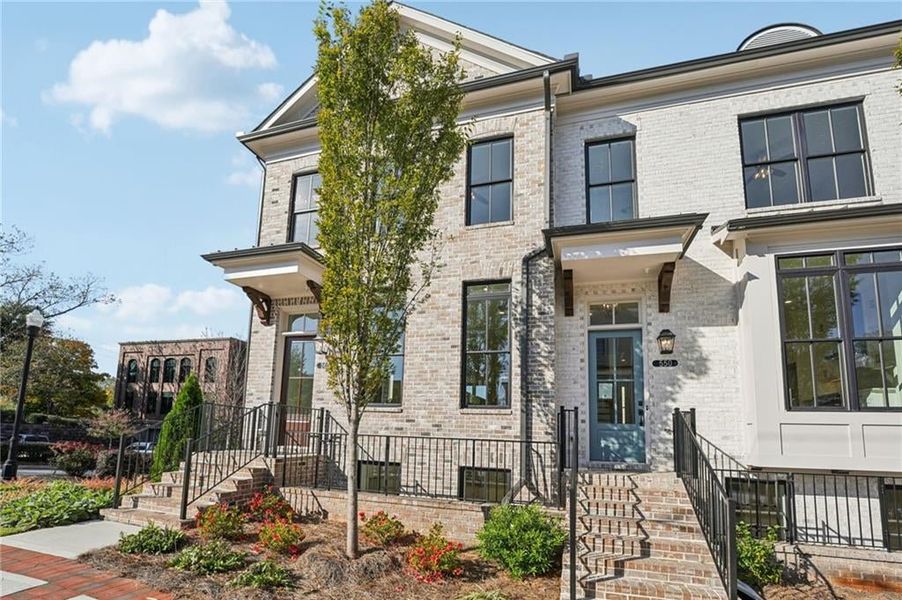 Brick front brownstone vibes- beautiful from the outside, even more stunning on the inside.  Come tour in person. Image is of previously built Chamberlain plan.
