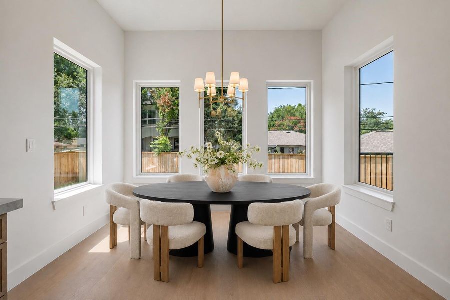 Breakfast nook with lots of natural lighting. Virtual staging.