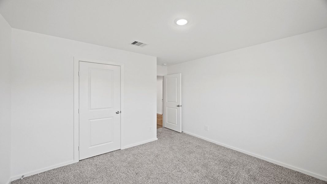 Representative unfurnished interior of a home built from the Carson by D.R. Horton in Lexington Heights, Willis (Image 20).