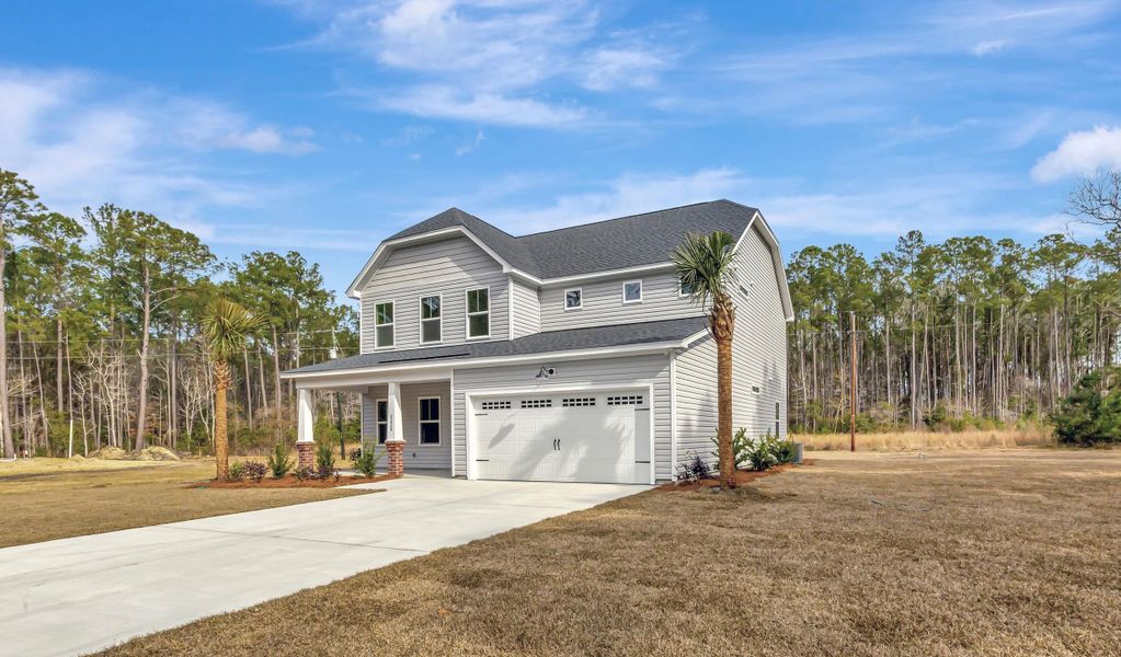 Front exterior of a new home in , Awendaw, SC, highlighting curb appeal (Image 18). Front exterior of a new home in , Awendaw, SC, highlighting curb appeal (Image 18).